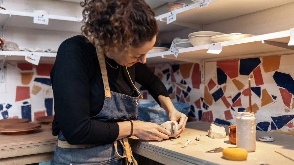 Woman making a coffee cup